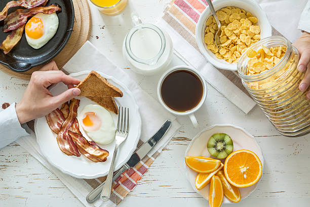 istock Family eating american breakfast 526544124