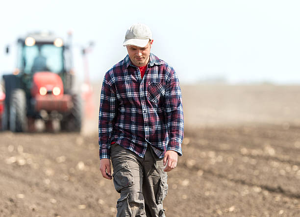 istock young farmer on farmland 526545024