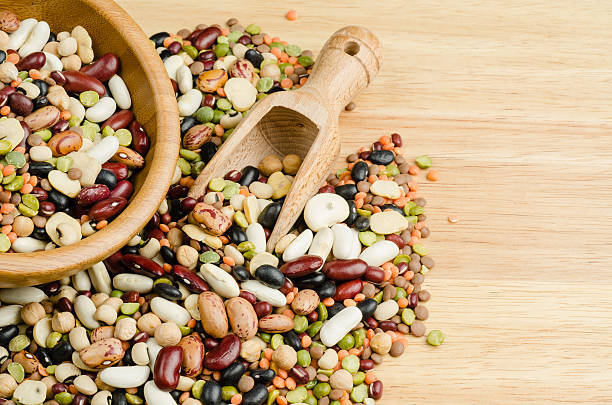 istock legumes on wood, closeup, background 526545639