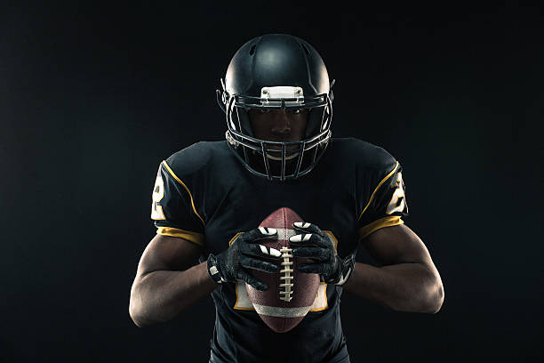 フットボール選手 - american football sport university football player ストックフォトと画像