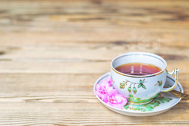istock Cup of hot fresh tea on a wooden table. 526548290