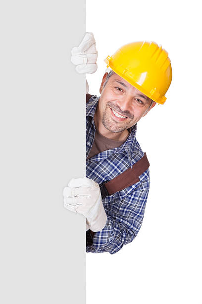 istock Portrait Of Happy Contractor Holding Placard 526550041