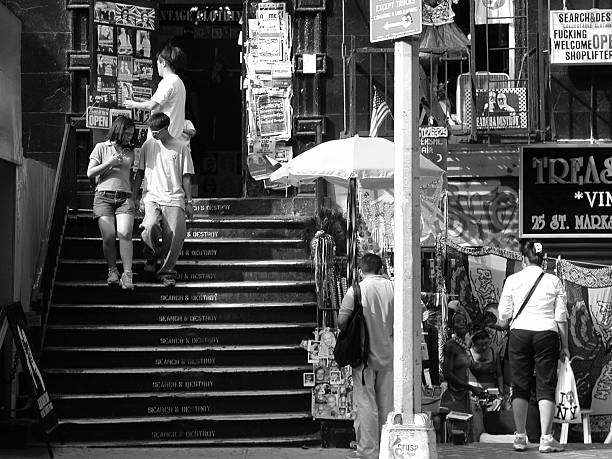 Montreal, Canada - July 4, 2024. Tourists and street musician in the old town of Montreal, Quebec, Canada