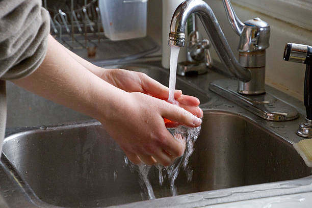 istock Washing Hands Before Handling Food 526550621