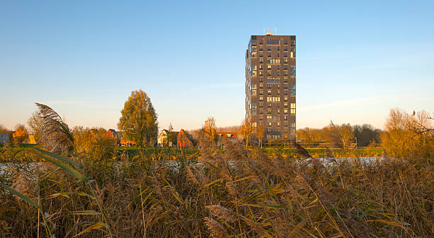 istock Highrise along a river at sunset in autumn 526552039