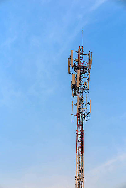 istock Antenna and telecommunication tower in blue sky background 526552510