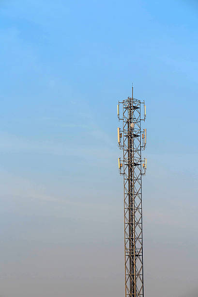 istock Antenna and telecommunication tower in blue sky background 526552672