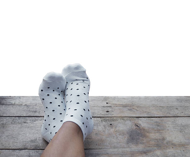 istock feet wearing white polka dot socks 526552746