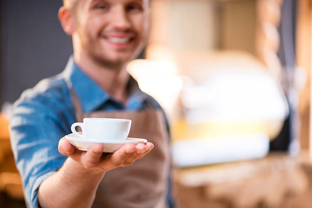 istock Pleasant waiter  working in the cafe 526554478