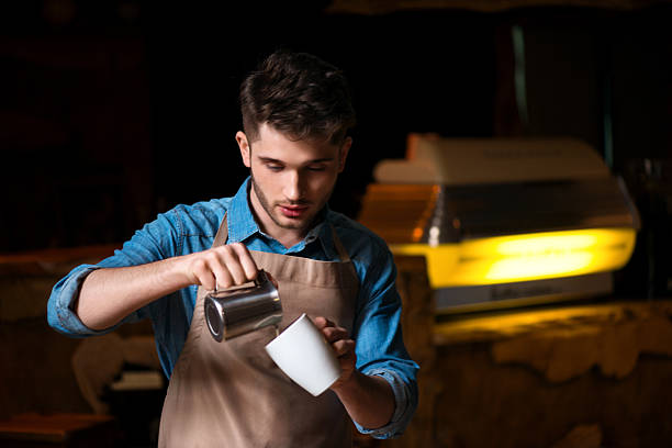 Pleasant barista   working in the cafe