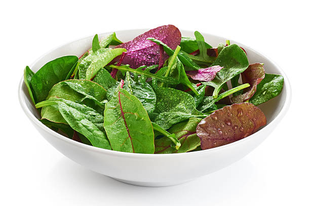 istock Bowl with fresh green salad isolated on white background. 526555208