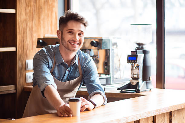 istock Pleasant waiter  working in the cafe 526556130