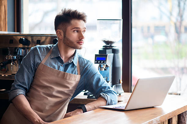 istock Pleasant barista  standing at the counter 526557466