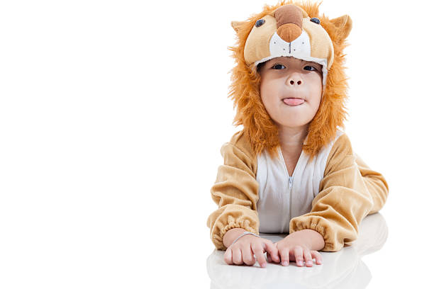 istock Cute little boy dressed in lion suit. Isolated on white 526558004