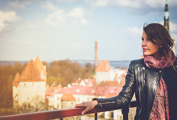 Modern woman spending time in outdoors at Tallinn Old Town.