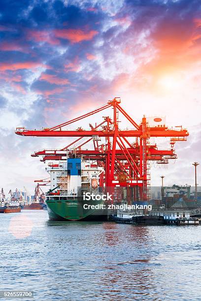 Industrial Container Freight Trade Port Scene At Sunset Stock Photo - Download Image Now