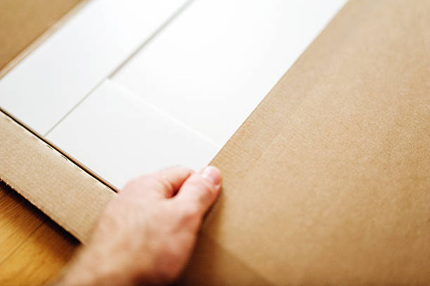istock Man installing new white furniture 526561246