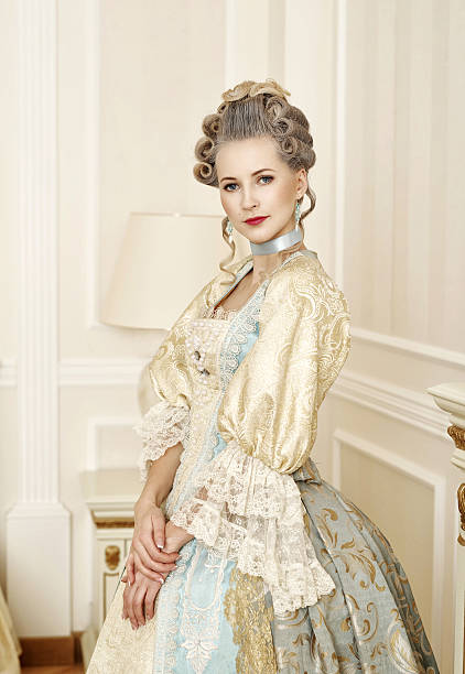 Beautiful woman in historical dress in Baroque style Beautiful woman in historical dress in Baroque style in the interior renaissance dress stock pictures, royalty-free photos & images