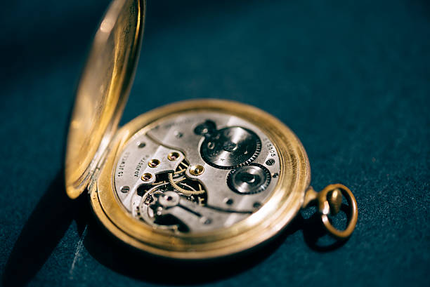 istock Golden pocket watch mechanism 526564438