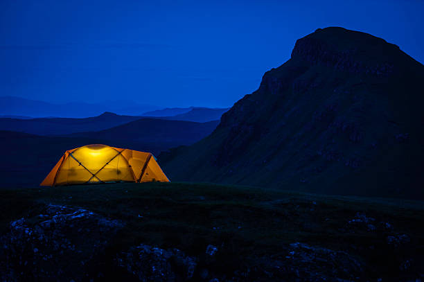 istock Wamly illuminated dome tent in dramatic mountain landscape at night 526564584