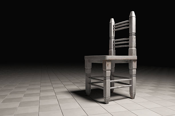 istock Wooden chair abandoned in empty room 526564692