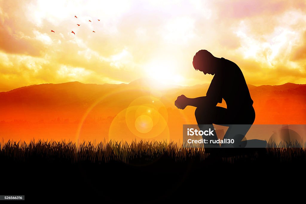 Morning Pray At Beautiful Landscape Silhouette illustration of a man praying outside at beautiful landscape Praying Stock Photo