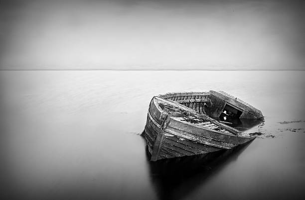 istock Old boat abandoned in water 526567504