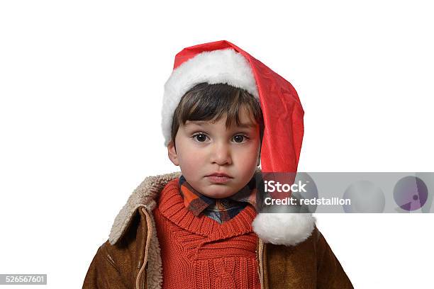 Preschooler Looking Serious With Santa Hat Stock Photo - Download Image Now - 2-3 Years, Anticipation, Baby - Human Age