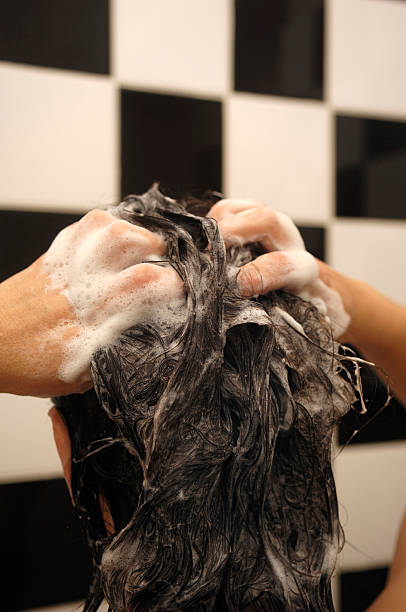 istock girl washing her hair 526568457