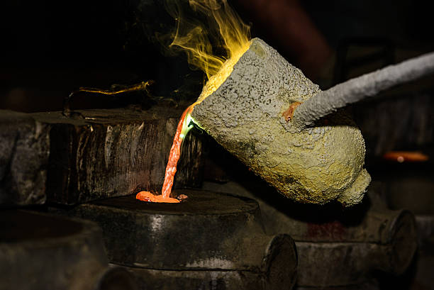 istock Melted metal pouring in a mold 526569127