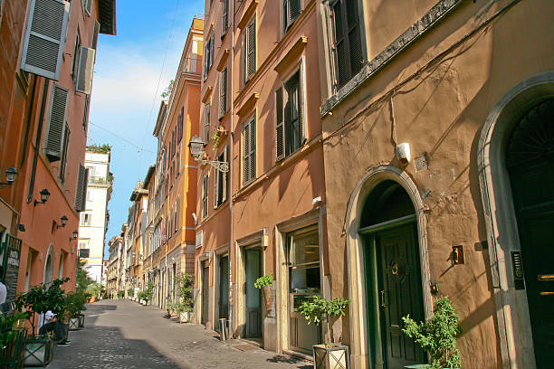 Rome, Italy - July 6, 2015: Beautiful 16th century terracotta coloured buildings of Via dei Coronari in the historic centre of Rome, Italy