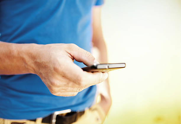 istock Close up of a man using mobile smart phone 526569643