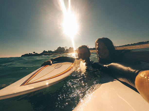 istock Couple of surfers making a selfie 526570082