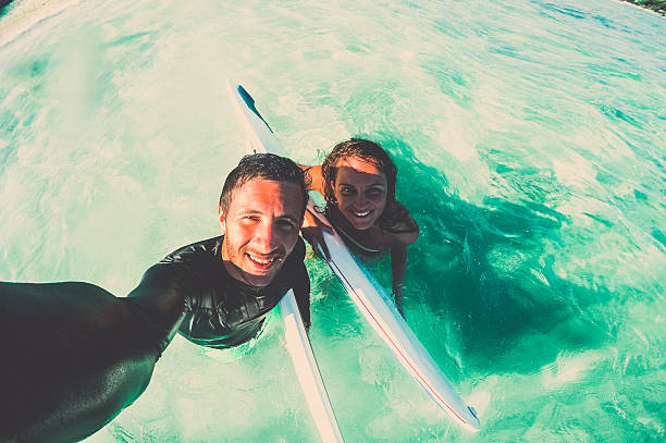 istock Couple of surfers making a selfie 526570238