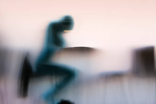 istock Figure behind opal glass pane 526572025