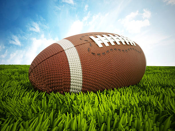 istock American football on the grass 526572359