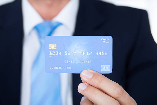 istock Young Businessman Holding Credit Card 526595145