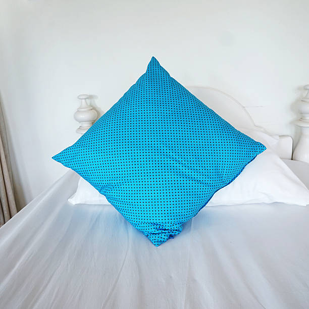 istock blue and white pillows on bed in bedroom 526596477