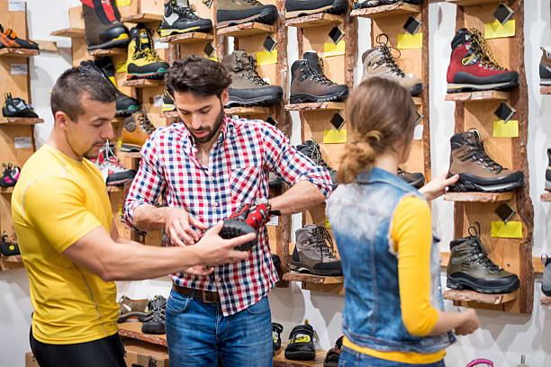 istock Young people buying hiking boots 526599917