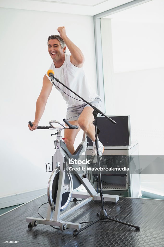 exercising instructor motivating his class exercising instructor motivating his class at the gym 40-44 Years Stock Photo