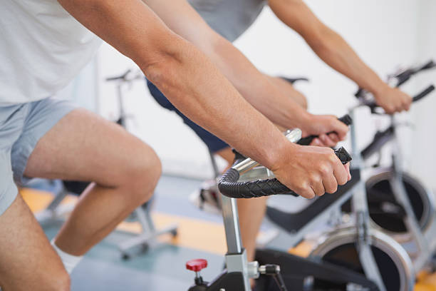 istock Fit people working out on the exercise bikes 526600513