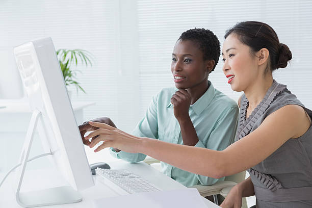 istock Businesswomen working together at desk 526634541