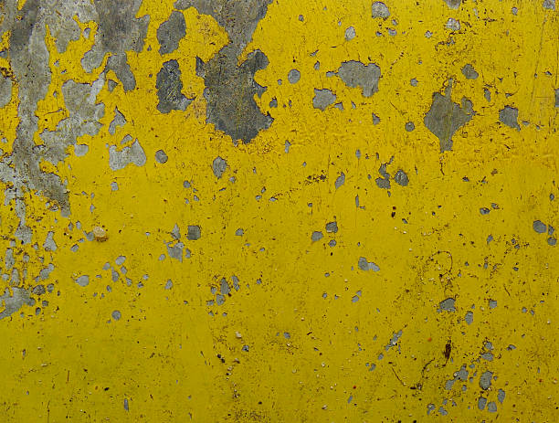 istock yellow painted metal with paint peeling 526635255