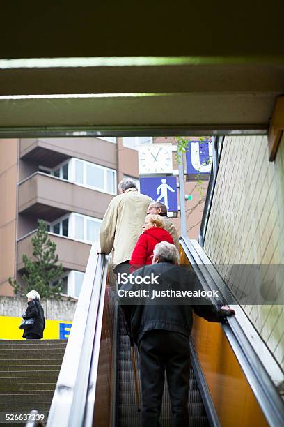 Seniors On Escalator Upstairs Stock Photo - Download Image Now - Adult, Editorial, Escalator