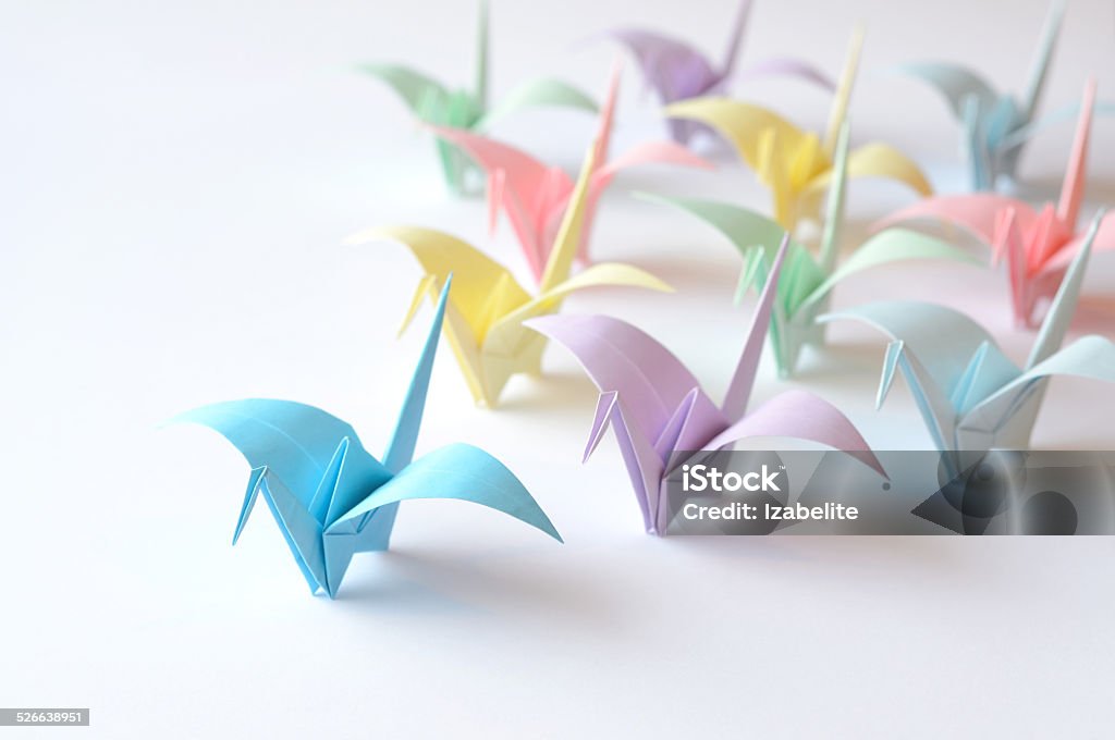 Coloured origami birds Coloured origami birds flying to the light Animal Stock Photo