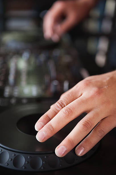 istock Close up of hands spinning the decks 526639777