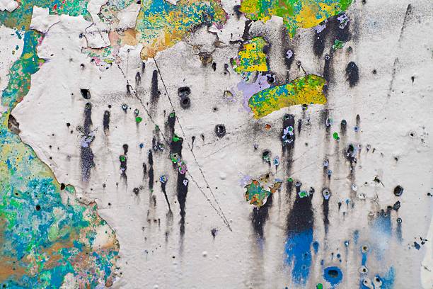 istock Wall with several layers of paints and holes on it 526640065