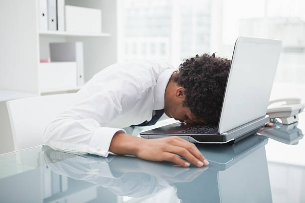 istock Businessman sleeping on his laptop 526641185