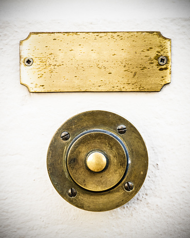 old bell button and nameplate at a villa near rome