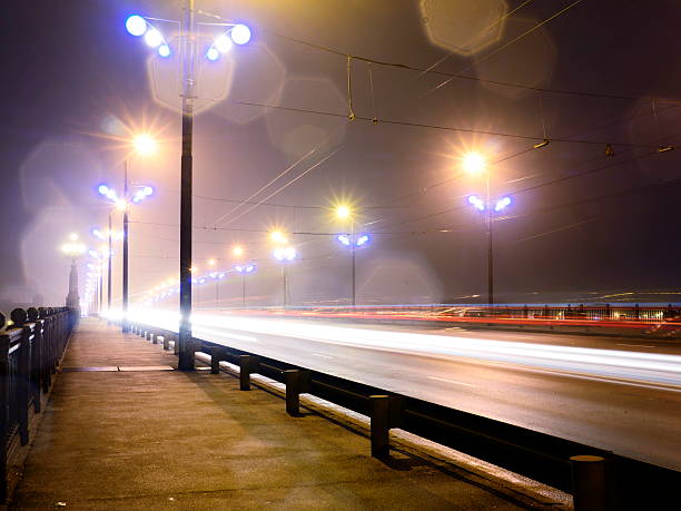 istock Stone Bridge lights in fog ,Riga 526650891